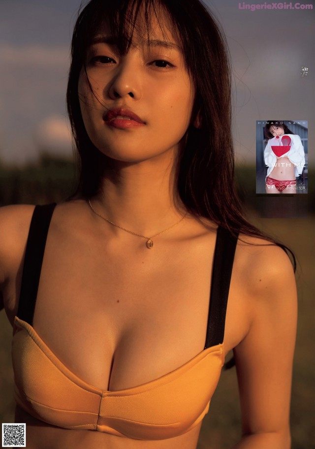 A woman in a bikini posing for a magazine.