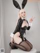 A woman in a bunny costume posing for a picture.